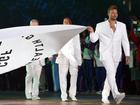 Ian Thorpe carries the Commonwealth Games Federation flag at Glasgow's opening ceremony in 2014. (Dean Lewins/AAP PHOTOS)