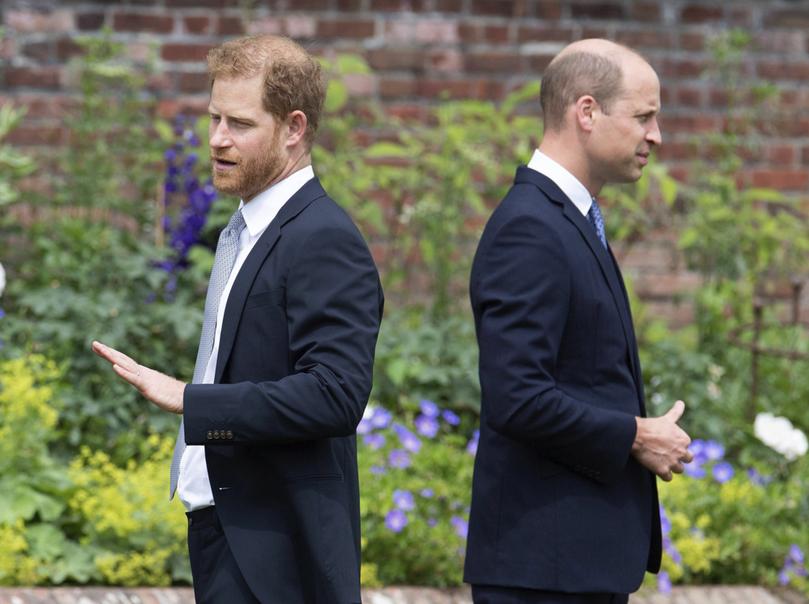 FILE - Prince Harry, left, and Prince William stand together during the unveiling of a statue they commissioned of their mother Princess Diana, on what would have been her 60th birthday, in the Sunken Garden at Kensington Palace, London, Thursday July 1, 2021. Prince Harry has said he wants to have his father and brother back and that he wants ?a family, not an institution,? during a TV interview ahead of the publication of his memoir. The interview with Britain?s ITV channel is due to be released this Sunday. (Dominic Lipinski /Pool Photo via AP, File)