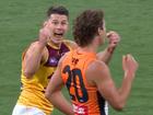 Dayne Zorko celebrates in front of James Peatling after the final siren.