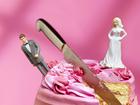 knife cutting between bride and groom figurines, relationship breakup