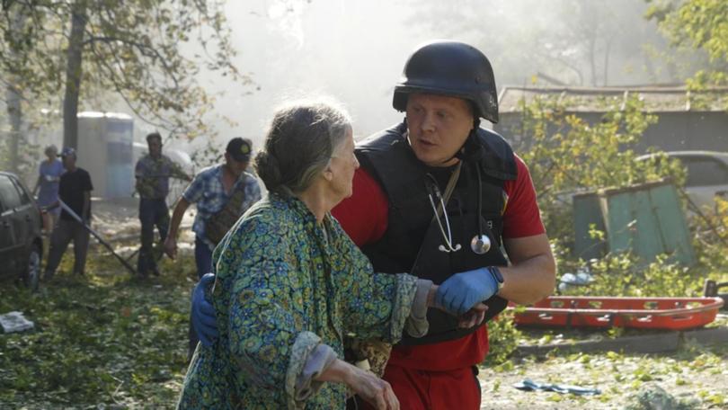 Residents have been assisted in the Ukrainian city of Kharkiv after a building was struck.