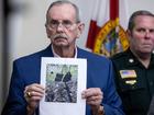 Sheriff Ric L. Bradshaw shows a picture of an AK-style rifle with a scope, and bags found by the Secret Service at the Trump International Golf Club.