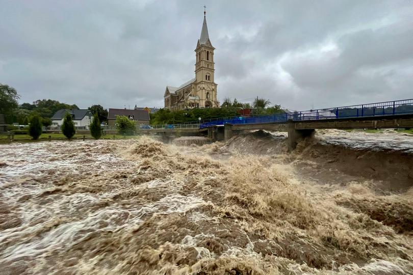 A torrent of water flows along the river Bela during heavy rain on September 14, 2024 in Mikulovice, Czech Republic.