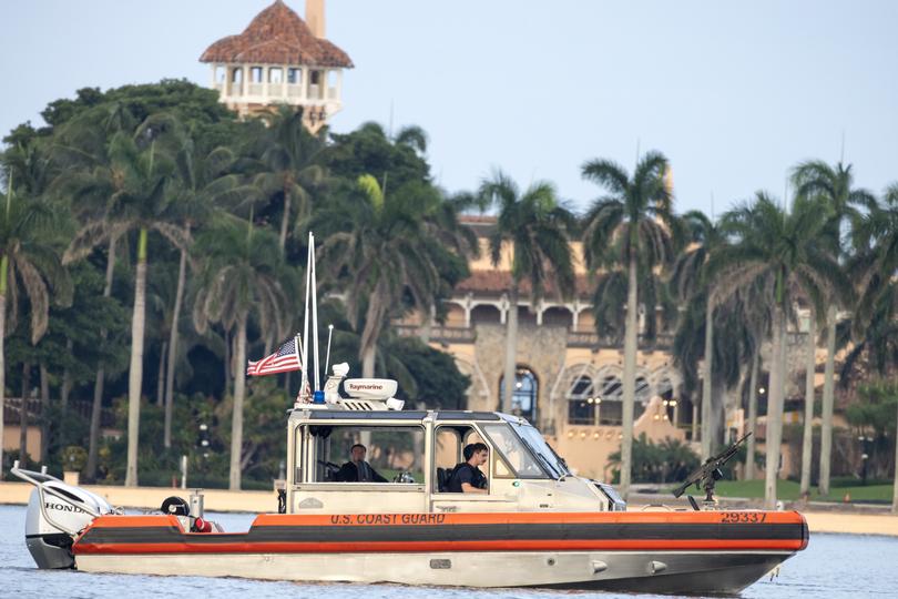 Coast Guard officers guard the Mar-a-Lago residence. 