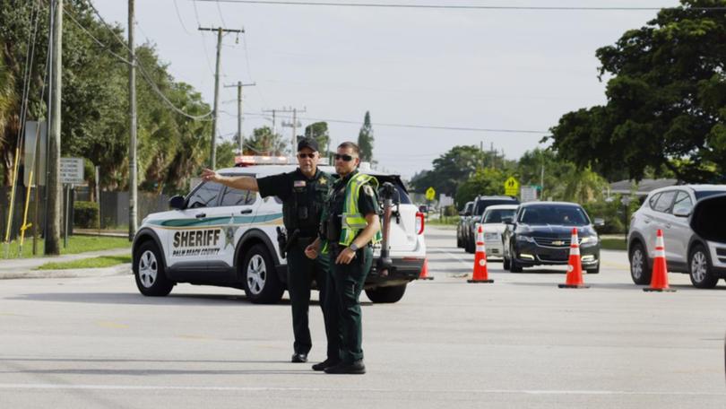 Police direct traffic near Trump International Golf Club