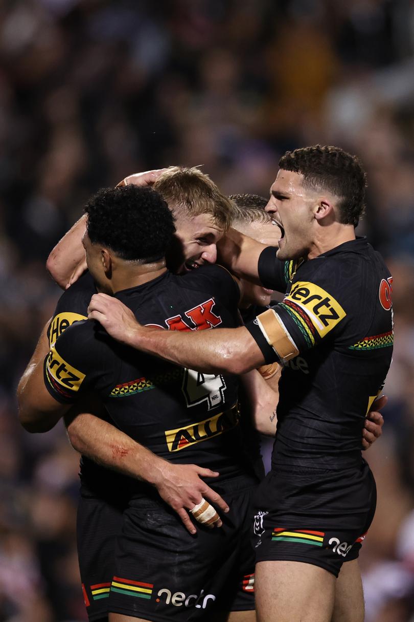 PENRITH, AUSTRALIA - SEPTEMBER 13: Luke Garner of the Panthers celebrates scoring a try with Paul Alamoti and Nathan Cleary of the Panthers during the NRL Qualifying Final match between Penrith Panthers and Sydney Roosters at BlueBet Stadium on September 13, 2024 in Penrith, Australia. (Photo by Cameron Spencer/Getty Images)