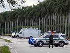 Palm Beach Sheriff officers guard the rear entrance of the Trump International Golf Club in Florida following the shooting.