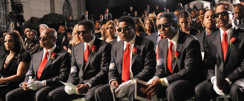 The Jackson Family sit together at Michael Jackson's funeral service. 