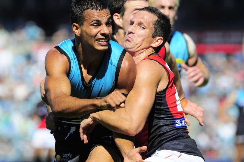 Bomber Hayden Skipworth collars Port Adelaide’s Danyle Pearce.