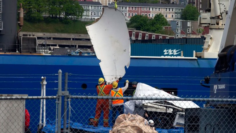 Debris from the Titan submersible, recovered from the ocean floor near the wreck of the Titanic, is unloaded from the ship Horizon Arctic at the Canadian Coast Guard pier on June 28, 2023.