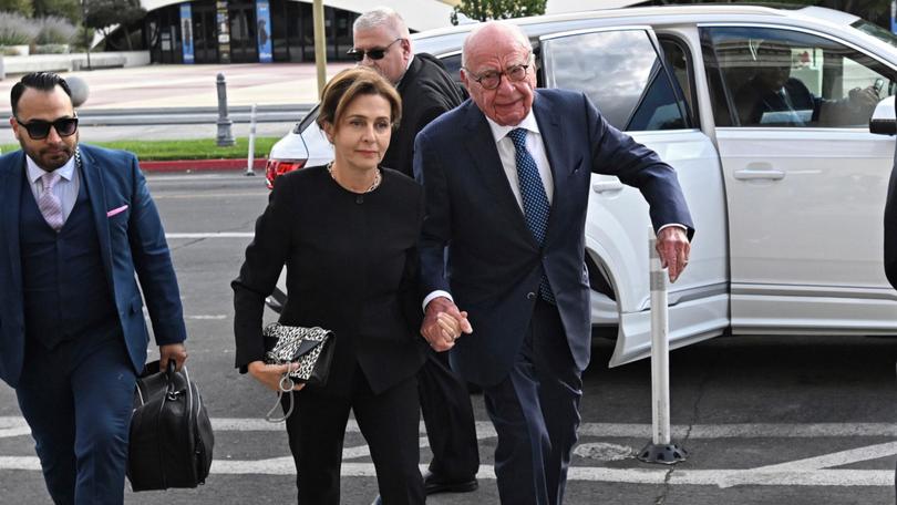 Rupert Murdoch, center, and his wife Elena Zhukova Murdoch arrive at the Second Judicial District Court in Reno, Nev., Monday Sept. 16, 2024. (AP Photo/Andy Barron) Andy Barron