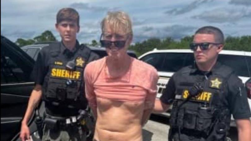 US police officers prepare to arrest Ryan Routh, the man suspected in the apparent assassination attempt of Donald Trump.