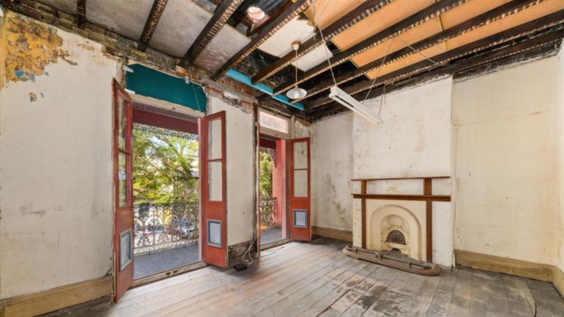 The dilapidated home at 13 Chapman Street in Sydney's Surry Hills attracted nine registered bidders.