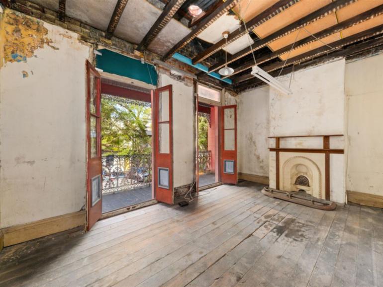 The dilapidated home at 13 Chapman Street in Sydney's Surry Hills attracted nine registered bidders.