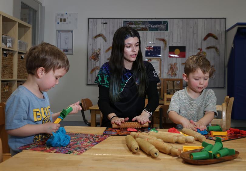 The Federal Government has just announced a 15 per cent wage increase for educators in the childcare sector. Pictured is educator Teneesha Syme with Dean Wicham (4) and Kobie Stott (3) at the facility