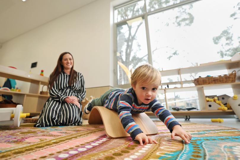 Lauren Smith, who is a junior school teacher at All Saints' College, with her son Jordie Ellis, 2, who attends the newly opened Little Saints Childcare situated on the school's campus at Bull Creek.