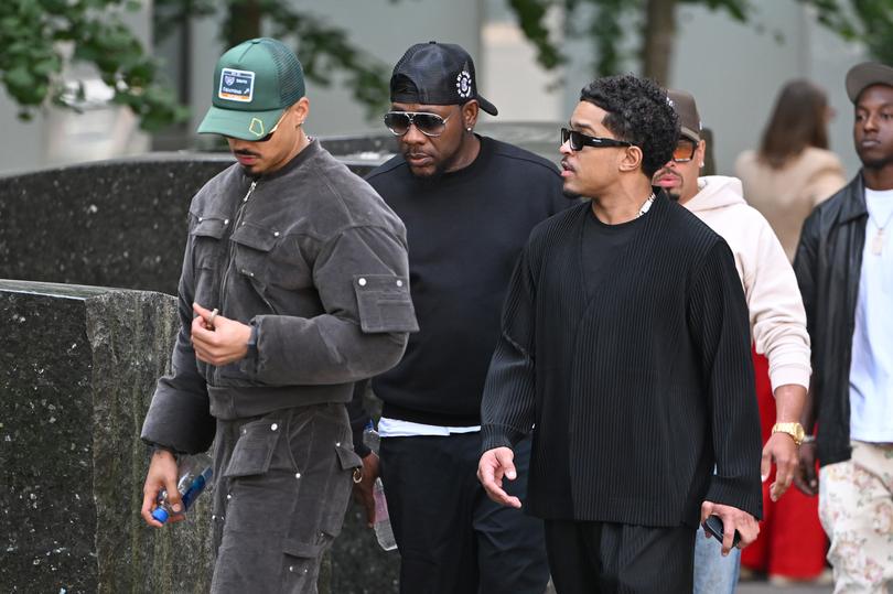 Justin Combs (r) and Quincy Combs (greet hat), sons of Sean Combs, arrive at U.S. District Court New York.