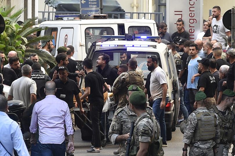 Paramedics transport an injured person to the American University of Beirut Medical Center (AUBMC) after an incident involving Hezbollah members' wireless devices in Beirut, Lebanon.