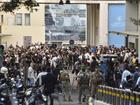 Lebanese soldiers and Hezbollah members gather outside the American University of Beirut Medical Center (AUBMC) after an incident involving Hezbollah members' wireless devices in Beirut, Lebanon.