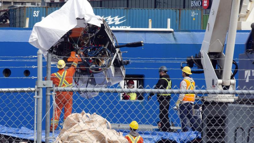 Debris from the Titan submersible, recovered from the ocean floor near the wreck of the Titanic, being unloaded in 2023.