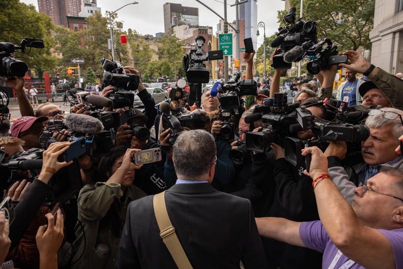 Marc Agnifilo, attorney for Sean "Diddy" Combs, centre, addresses the media outside court.