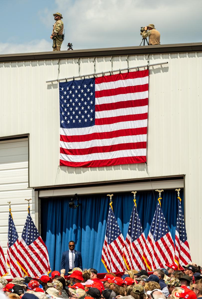 Security keeps watch as Donald Trump addresses a crowd in Asheboro, N.C., on Wednesday. 