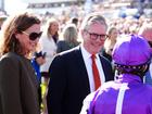 Prime Minister Keir Starmer and wife Victoria Starmer, left, speaks to jockeys ahead of the Betfred St Leger Stakes.