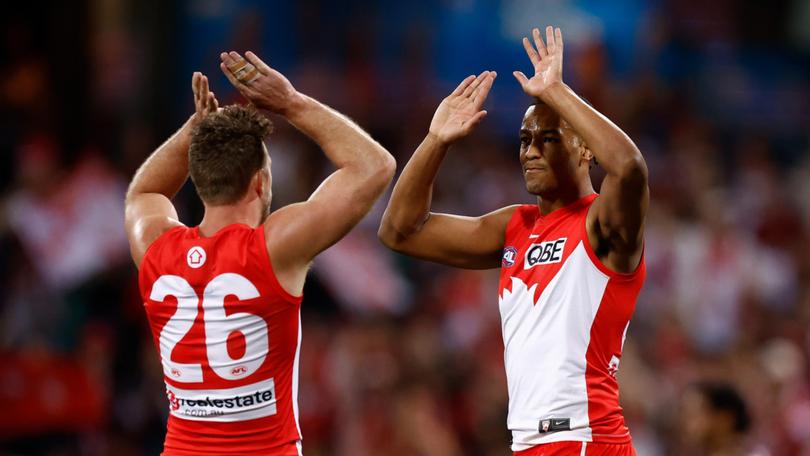 SYDNEY, AUSTRALIA - SEPTEMBER 20: Luke Parker (left) and Joel Amartey of the Swans celebrate during the 2024 AFL First Preliminary Final match between the Sydney Swans and the Port Adelaide Power at The Sydney Cricket Ground on September 20, 2024 in Sydney, Australia. (Photo by Michael Willson/AFL Photos via Getty Images)