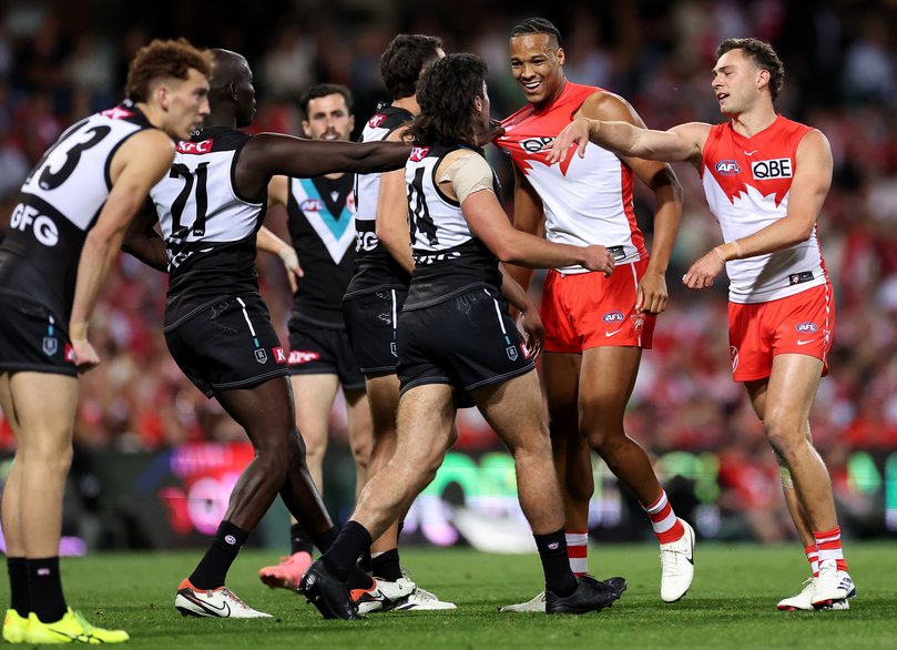 SYDNEY, AUSTRALIA - SEPTEMBER 20: Joel Amartey of the Swans and Lachie Jones of the Power wrestle during the AFL Preliminary Final match between Sydney Swans and Port Adelaide Power at Sydney Cricket Ground, on September 20, 2024, in Sydney, Australia. (Photo by Cameron Spencer/Getty Images)