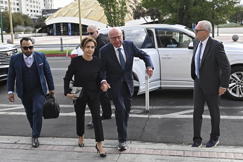 Rupert Murdoch, center, and his wife Elena Zhukova Murdoch arrive at the Second Judicial District Court in Reno, Nev., Monday Sept. 16, 2024. (AP Photo/Andy Barron)