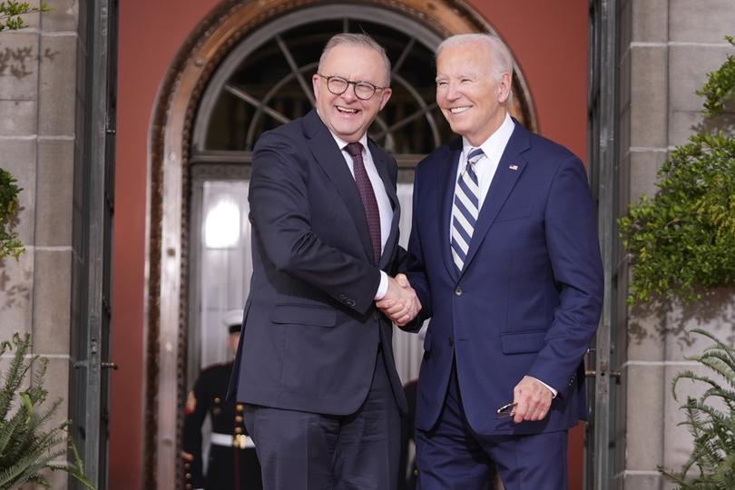 President Joe Biden greets Anthony Albanese at the Quad leaders summit.