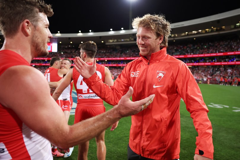 SYDNEY, AUSTRALIA - SEPTEMBER 20: Callum Mills of the Swans celebrates victory with team mates after the AFL Preliminary Final match between Sydney Swans and Port Adelaide Power at Sydney Cricket Ground, on September 20, 2024, in Sydney, Australia. (Photo by Matt King/AFL Photos/Getty Images)