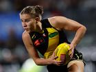 Richmond star Ellie McKenzie has escaped an AFLW ban after her rough conduct charge was downgraded.