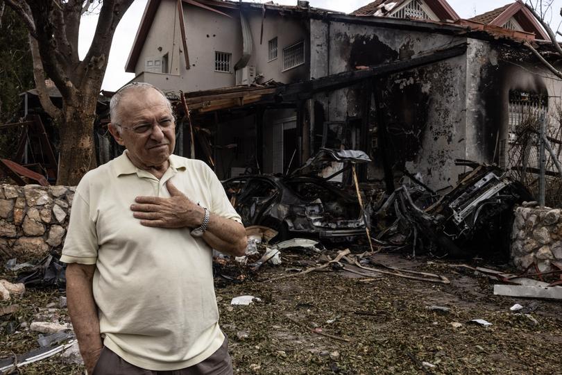 Moti Fitch, 75, outside his damaged home in Moreshet in northern Israel following a rocket barrage fired from Lebanon that heavily damaged homes and cars on Sunday. 