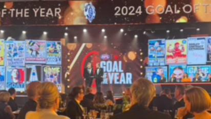 Harley Reid of the Eagles is presented the NAB AFL Goal of the Year by Chris Judd.