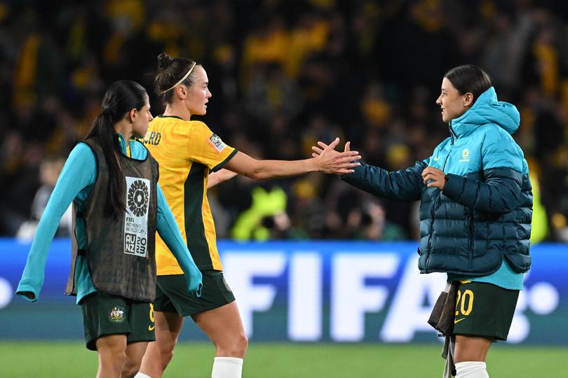 Sam Kerr of Australia (right) shakes hands with Caitlin Foord during the FIFA Women's World Cup 2023 Round of 16 soccer match between Australia and Denmark at Stadium Australia in Sydney, Monday, August 7, 2023. (AAP Image/Dean Lewins) NO ARCHIVING, EDITORIAL USE ONLY