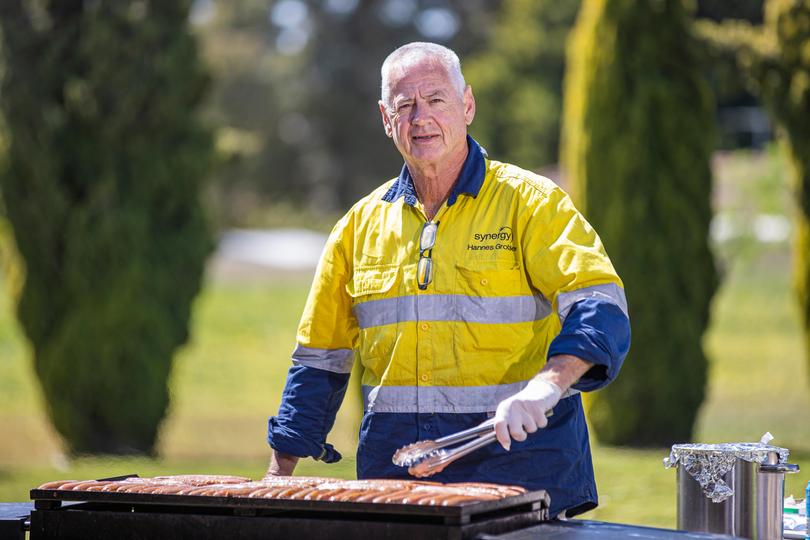 Chef Matt Fahie cooks a barbecue outside the community centre for residents of Shalom House.