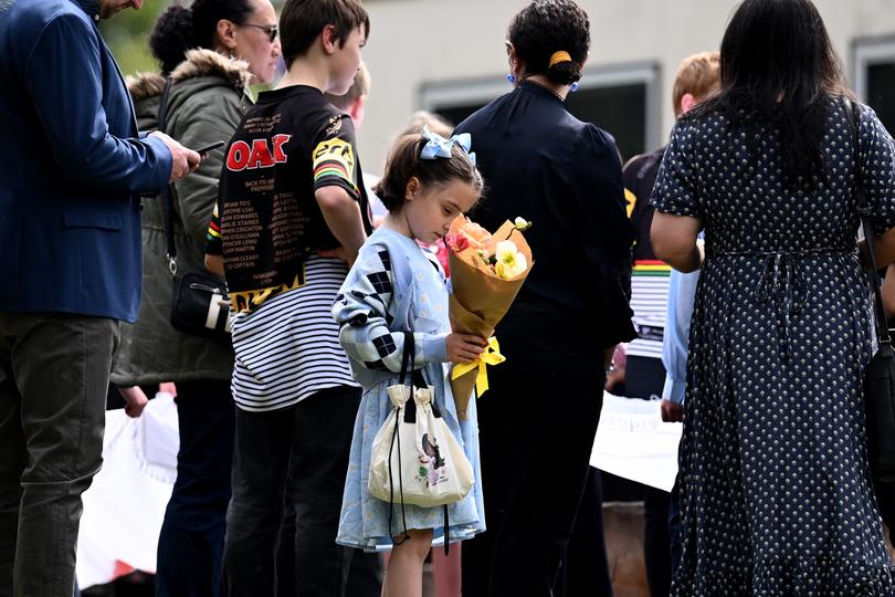 Mourners are seen prior to the funeral service for Ben and Russell Smith. 