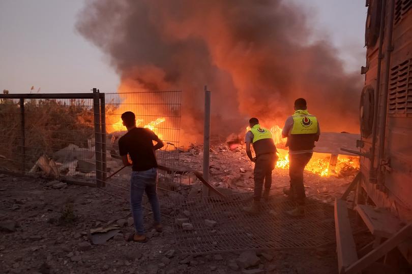 Rescuers rush to the scene of an Israeli airstrike that targeted the southern Lebanese village of Abbasiyeh on September 24, 2024. - Israel announced dozens of new air strikes on Hezbollah strongholds in Lebanon, a day after 558 people, including 50 children, were killed in the deadliest day of violence since the Lebanese civil war. (Photo by Kawnat HAJU / AFP)