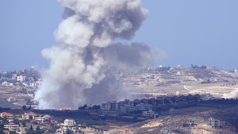 Smoke rises from Israeli airstrikes on villages in the Nabatiyeh district, seen from the southern town of Marjayoun, Lebanon, Monday, Sept. 23, 2024.(AP Photo/Hussein Malla)