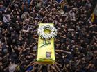 Hezbollah supporters carry a coffin at the funeral of two comrades killed Wednesday in the second wave of explosions in Beirut, Lebanon, Sept. 19, 2024. (Diego Ibarra Sanchez/The New York Times)