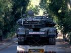 A truck carrying a tank moves toward Israel's northern border with Lebanon.