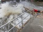 epa11627332 A visitor braves the high surf, storm surge and high winds of Hurricane Helene to take photos at the downtown of Cedar Key, Florida, USA, 26 September 2024. Hurricane Helene is strengthening as it moves toward the U.S. Gulf Coast becoming a Category 1 hurricane and is expected to hit Florida's Big Bend late today as Category 4 storm. Around 32 million people are under flood watches. EPA/CRISTOBAL HERRERA-ULASHKEVICH