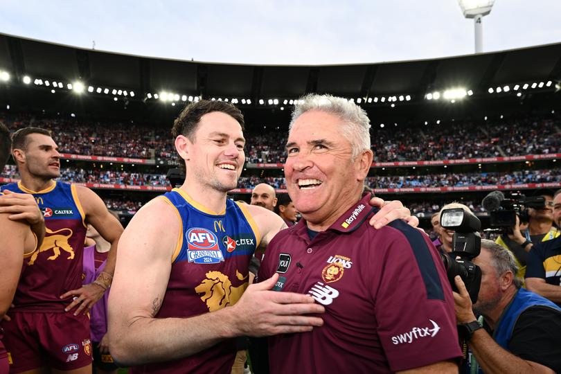 MELBOURNE, AUSTRALIA - SEPTEMBER 28: Chris Fagan, Senior Coach of the Lions and Lachie Neale of the Lions celebrate winning the premiership following the AFL Grand Final match between Sydney Swans and Brisbane Lions at Melbourne Cricket Ground, on September 28, 2024, in Melbourne, Australia. (Photo by Quinn Rooney/Getty Images via AFL Photos)