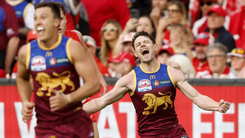 Lachie Neale celebrates winning the grand final.