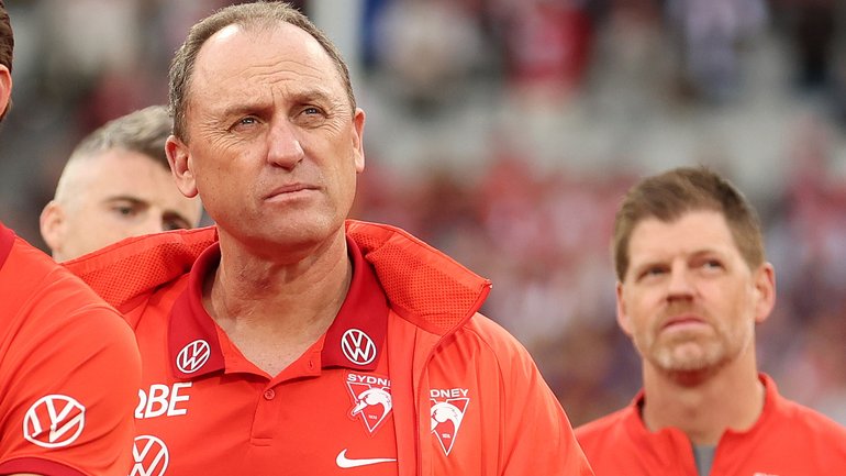 John Longmire looks on during the post-game presentations.