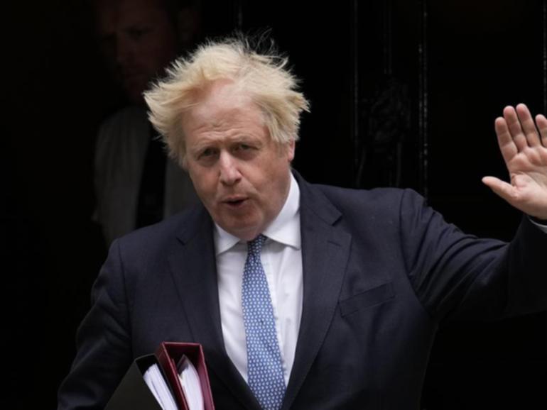 Boris Johnson says the idea of an army raid on a Dutch factory over COVID-19 vaccines was "nuts". (AP PHOTO)