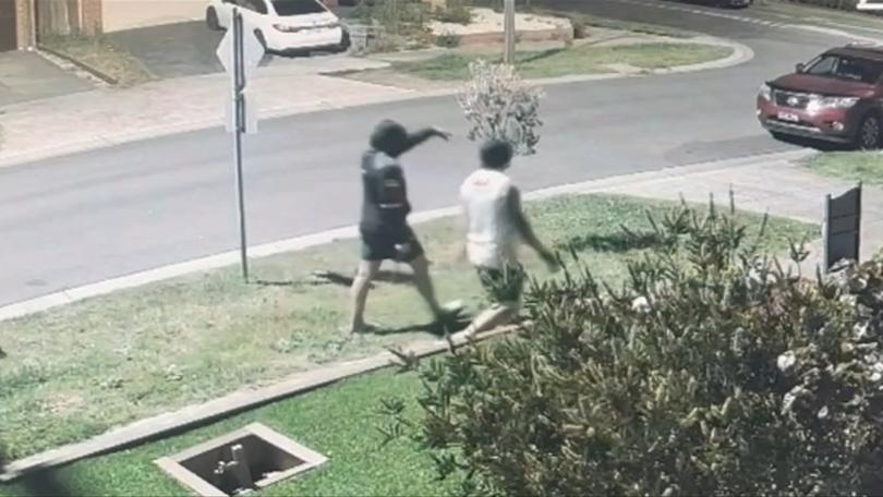 Two men were seen in CCTV footage approaching the residents hosting the gathering.