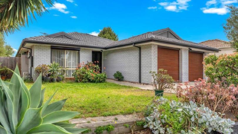 A renovated home at 12 Wrigley Crescent, Roxburgh Park sold to a young couple with a bid of $600,000.