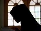 A student reads the Quran at an Islamic school in Australia. 